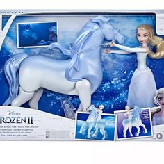 the frozen princess doll is in its box with pictures and instructions to make it look like she's riding a horse