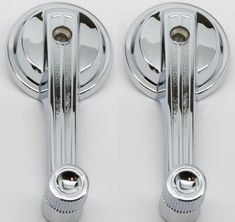 two chrome door handles on a white background