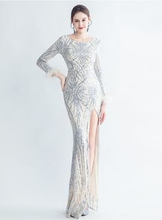 Allow the night to drape around you in this beautiful mermaid silhouette dress, echoing the whispers of the ancient mermaids. The scoop neckline is like the calm before the storm, subtle yet promising a night filled with tales of elegance. The sequins are like a river of stars flowing down the fabric, capturing the essence of the night sky. The long sleeves, ending in a feathered flourish at the wrists, whisper tales of gentle yet wild elegance, a nod to the free spirits. The high slit is a touch of the wild amidst the elegant, promising a night of unforgettable memories. This dress isn't just a dress, but a tale of elegance waiting to be told. Mermaid Silhouette Dress, The Calm Before The Storm, Gold Mermaid, Silhouette Dress, The Whispers, Black Mermaid, Mermaid Sequin, Short Party Dress, Calm Before The Storm