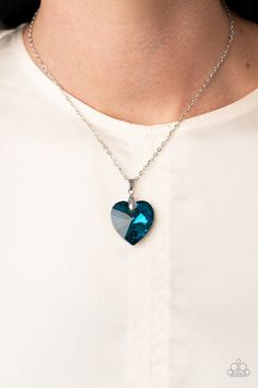 Chiseled into a charming heart, an oversized blue gem slides along a dainty silver chain below the collar for a flirtatious finish. Features an adjustable clasp closure.

Sold as one individual necklace. Includes one pair of matching earrings. Love Hurts, Paparazzi Accessories, Blue Heart, Matching Earrings, Silver Chain, Slides, Collar, Chain, Blue