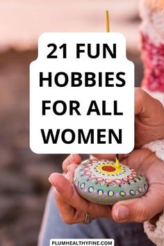 a person holding a rock with the words, 21 fun hobbies for all women