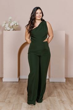 Our Lennon Jumpsuit is now available in all our crepe colors, making it the perfect option for the bridesmaid who desires a unique and edgy alternative to a dress! Lennon is modern and elevated in its design, featuring a one-shoulder draped bodice and a mid-size side cut-out that hits near the waist on the left side with wide straight-leg pants, creating a feeling of effortless beauty. FEATURES: Fitted silhouette One shoulder neckline, thick shoulder strap on the left side Built-in bra cups and Chic Bridesmaid Jumpsuits And Rompers, Fitted Sleeveless Bridesmaid Jumpsuits And Rompers, Fitted Sleeveless Bridesmaid Jumpsuit, Chic Green Pantsuit For Party, Wedding Parties Colors, Draped Bodice, Crepe Jumpsuit, Beauty Features, Effortless Beauty