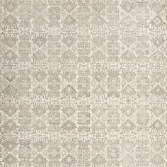 a beige and white rug with an intricate design on the bottom half of it,