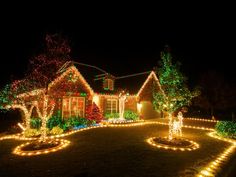 christmas lights decorate the front yard of a house