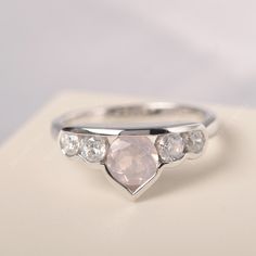 All HANDMADE ITEMS SHIP IN APPROX 8 DAYS Main Stone: Genuine natural pink quartz Main Stone Size: Round cut 6 mm x 6 mm Main Stone Weight: 0.86 carat Side Stone: CZ Height From The Ring Setting Bottom(to gemstone top): about 4.76 mm Width of Ring band Measure: gradually varied,about 2.28 to 2.37 mm Material: 925 Sterling Silver/14K White Gold/14K Yellow Gold/14k Rose Gold Engraved: Available For FreeNo more than 13 letters) Customized:Of course! Tell me what you want Includes With Order: All of Pink Wedding Jewelry With Bezel Setting, Rose Quartz Engagement Ring, Blue Topaz Ring Silver, Rose Quartz Ring Engagement, Feminine Urge, Quartz Engagement Ring, Girl Shopping, Pretty Jewelry Necklaces, Wedding Rings Solitaire