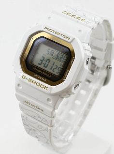 Japan only model This edition commemorates the 30th Anniversary of G-Shock’s partnership with I.C.E.R.C., which started with the release of the DW-6100DW-9 in 1994. This year’s trio of watches have a white and gold color scheme to represent summer and the anniversary celebration. They feature new artwork by Hitomi Arata, with thirty types of whales and dolphins, that adorns the bands and packaging. The bezels and bands are made of bio-based resins, and the packaging is made of recycled cardboard White Watch With Date Display As Gift, G Shock Frogman, Types Of Whales, Gold Color Scheme, Recycled Cardboard, Casio G Shock, 30th Anniversary, R C, G Shock