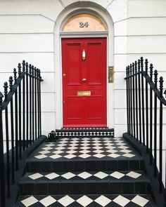 Red front door entry with wrought iron railing and black and white tiles stairs Black And White Stairs, The Door Is Open, New Experiences, Black And White Tiles, Open The Door, Open Doors, Red Door, Real Estate Tips, New Opportunities