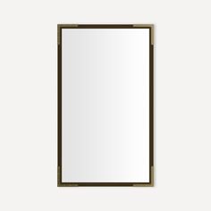 a mirror that is on the wall with a wooden frame and metal trim around it