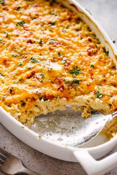 a casserole dish with cheese and parsley on top, ready to be eaten