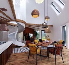 a dining room and kitchen area with spiral staircase leading up to the second floor that overlooks an outdoor deck