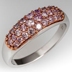 This lovely 14K white gold domed ring contains twenty-eight (28) round brilliant cut pink diamonds that are all pave set in rose gold tips. The ring measures 7.0mm at the top, rises 4.6mm above the finger, tapering to 2.5mm wide and 1.1mm thick at the base of the shank. This ring is currently a size 8 7/8. Fine Jewelry 14k Pink Gold Diamond Ring, Pink 14k Gold Fine Jewelry Diamond Ring, Pink Rings With Polished Finish Fine Jewelry, Fine Jewelry Pink Rings With Polished Finish, Luxury 14k Pink Gold Ring, Pink Diamonds, Gold Tips, Dome Ring, Domed Ring