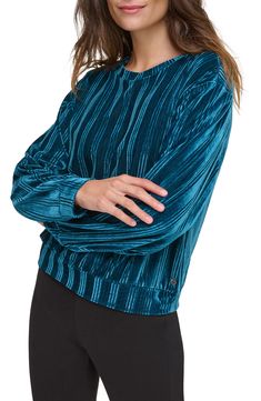 Perfect for a day or night out, this long-sleeve blouson top is fashioned from luxuriously soft ribbed velour for that classy-meets-comfortable look. 24" length Crewneck Long sleeves Elastic hem 96% polyester, 4% spandex Machine wash, tumble dry Imported Relaxed Fit Blouson Sleeves Tops For Fall, Casual Long Sleeve Blouson Tops, Casual Winter Top With Blouson Sleeves, Casual Winter Tops With Blouson Sleeves, Winter Crew Neck Tops With Blouson Sleeves, Trendy Blouson Sleeve Tops For Fall, Trendy Fall Tops With Blouson Sleeves, Trendy Tops With Blouson Sleeves For Fall, Sport Long Sleeve