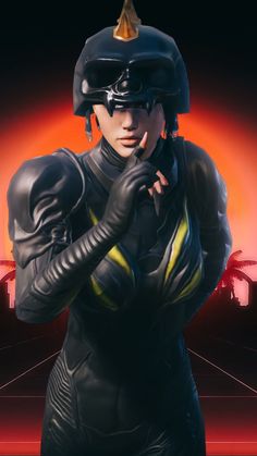 a woman dressed in black and wearing a helmet with her hand on her hip, standing against an orange background