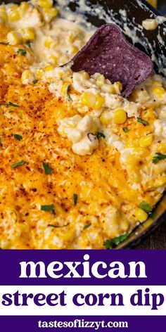 mexican street corn dip with tortilla chips in a cast iron skillet on a wooden table