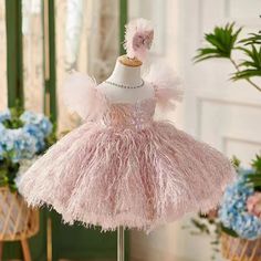 This Dreamy Vow dress is perfect for any special occasion. Made with elegant pink flowers and adorned with a hairband and feathers, it will make your little one stand out. Perfect for weddings, birthdays, communions, and pageants. Expertly crafted for the utmost comfort and style.