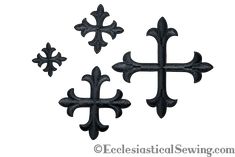 three black iron crosses on a white background