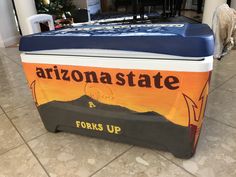 an arizona state cooler sits on the floor