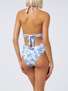 This elegant one-piece swimsuit showcases a deep V neckline both at the front and back, in a pure Marylin style, complemented by a wide-tone belt that accentuates the waist. It features broad straps and offers regular coverage at the bottomWoman one-piece swimsuitLow cut necklineUnderbust bandBroad strapsNormal bottom coverageToile de jouy all over printComposition: 90% polyamide 10% elastaneModel is 176 cm and wears a size S One-piece Beachwear Swimwear With Back Closure, One-piece Swimwear With Back Closure For Beachwear, Beachwear One-piece Bodysuit With Tie Back, Beach Swimwear With Low Back And Back Opening, Low Back Swimwear With Back Opening For Beach, Elegant Low Back Swimwear For Vacation, Beachwear One Piece With Triangle Top And Lined Body, Beachwear Triangle Top One Piece With Lined Body, Triangle Top Beachwear One Piece With Lined Body