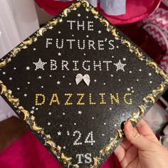 someone is holding up a graduation cap that says the future's bright dazzleling