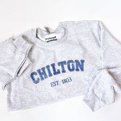 a child's sweatshirt with the word chillton on it and blue letters across the chest