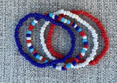 These custom 4th of July bracelets are perfect for this Independence Day! Stack solid colored bracelets with mixed bracelets to match your most patriotic outfit. TO ORDER: 1. Pick bracelet length 2. Submit and I'll get to work :) PRODUCT DETAILS: - Bracelets are made with sturdy jewelry elastic - Listing is for four bracelets. - All orders are final. Please double check your bracelet size. CARING TIPS: - Do not expose jewelry to water - Treat and store jewelry gently - Roll bracelets on rather t Bracelet Ideas Fourth Of July, 4 Of July Photos, 4th Of July Seed Bead Bracelets, Patriotic Beaded Bracelets, 4th Of July Necklace, 4 Of July Bracelets, Red White And Blue Clay Bead Bracelet, 4th Of July Friendship Bracelets, 4th Of July Jewelry Ideas