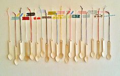 there are many spoons lined up on the wall