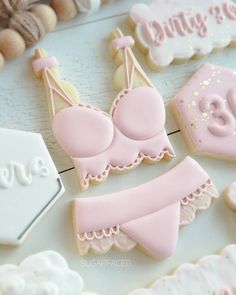 some decorated cookies are laying on a table