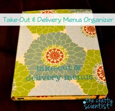 the take - out and delivery menu organizer is sitting on top of a black table