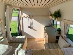 the inside of a camper with lots of windows