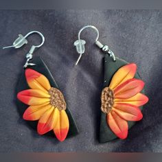 the earrings are decorated with flowers on them