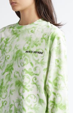 A brightly blooming print brings welcome color to a long-sleeve cotton top finished with dropped shoulders and a bold logo. 30" length (size Medium) Crewneck Long sleeves Dropped shoulders 100% cotton Hand wash, line dry Made in Italy Designer Clothing Relaxed Fit Logo Print Sweatshirt For Spring, Oversized All Over Print Tops For Spring, Oversized Spring Tops With All Over Print, Oversized Tops With All Over Print For Spring, Oversized Cotton Tops With All Over Print, Spring Green Sweatshirt With Screen Print, Green Spring Sweatshirt With Screen Print, Green Screen Print Sweatshirt For Spring, Spring Oversized Tops With Logo Print