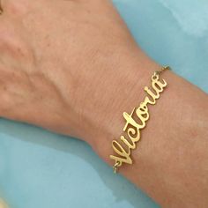 Personalized 14k - Name Bracelet - Solid Gold Bracelet - Custom Name Bracelet - Name Jewelry - Christmas Gift - Personalized Gift - Victoria . . . . . . . . . . . . . . . . . . . . . . . . . . . . . . . . . . . . . . . . . . . . . . . . . . . . . . . . . . . Looking for a thoughtful gift for your loved one? You will love this high quality Personalized 14k Name Bracelet. This is a perfect gift for your girlfriend or wife. This lovely Personalized 14k Solid Gold Name Bracelet is made to order. Pur Custom Name Bracelet Jewelry For Valentine's Day, Elegant Nameplate Charm Bracelet For Gift, Gold Charm Bracelet Gift, Elegant Nameplate Charm Bracelet Gift, Personalized Gold Bangle Bracelet For Gift, Customized Gold Name Bracelet, Yellow Gold Name Bracelets For Mother's Day, 14k Gold Bracelet Jewelry For Mother's Day, 14k Gold Mother's Day Bracelet