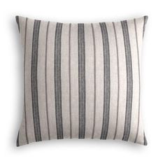 a gray and white striped pillow on a white background with black stripes in the middle