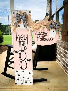 a happy halloween door hanger on the front porch