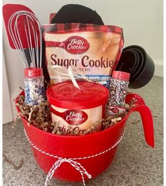 a red bucket filled with cookies and other items