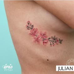 a woman's stomach with pink flowers on it