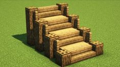 a set of stairs made out of wood on top of green carpeted flooring