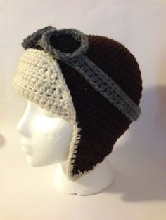 a crocheted hat on top of a mannequin head