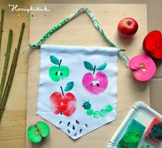 an art project with apples and green powder