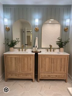 a bathroom with two sinks and mirrors on the wall above them is shown in this image