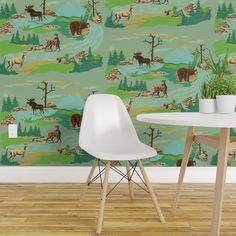 the wallpaper is very colorful and has animals on it, as well as trees