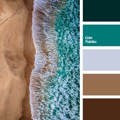 an aerial view of the ocean and beach with brown sand, green water and blue sky