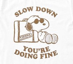 a white t - shirt that says slow down you're doing fine