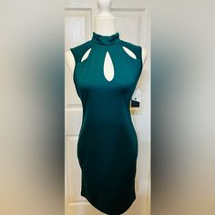 Beautiful Stunning Elegant Classy Straight Cut Sleeveless Teal Green Dress With Darling Cutouts On Top Of Dress. Slip On Dress With Two Button At Back Of Neck For Closure. Would Be Cute For A Night On The Town Wedding Or Any Event! New With Tags. Beautifully Made. 37 Inch From Shoulder To Bottom Of Hemline 9 Inches Armpit 16 Inch Across Bust 16 Inch Hips Extra Button Slight Stretch To Material Fully Lined Style Tags: Office, Career, Cut Outs, Business Casual, Simple, Neutral, Sleeveless , Staple Green Stretch Sleeveless Dress For Night Out, Chic Green Sleeveless Maxi Dress, Chic Green Sleeveless Dress, Green Stretch Sleeveless Dress For Date Night, Green Stretch Sleeveless Dress, Green Sleeveless Mini Dress For Date Night, Green Fitted Sleeveless Evening Dress, Fitted Green Sleeveless Halter Dress, Green Fitted Sleeveless Halter Dress