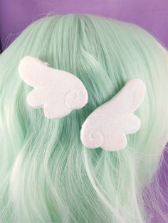 Be magical with these cute glittery hair clips. A pair of white magical girl wings in a classic anime style, they are coated in a shimmery iridescent glitter for maximum magical sparkle.  Wings have a silver alligator clips on the back More colors coming soon NOW AVAILABLE IN BLACK For international Shipping Quotes please send a message and a private listing will be created DO NOT CHECK OUT BEFORE YOUR PRIVATE LISTING HAS BEEN CREATED  For international orders refunds will be issued on a case by Magical Girl Hair, Fairy Kei Hair, Decora Hair, Classic Anime Style, Glittery Hair, Pastel Kidcore, Kawaii Hair Clips, Magical Girl Outfit, Kawaii Hair