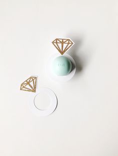 Diamond Ring shaped lip balm holders for EOS lip balms. To assemble simply unscrew the EOS Lip balm and place around the ring cutout 💍 These are perfect as an added touch to your bridesmaid proposal boxes or as party favors for your bridal shower, bachelorette party, or baby shower. Each holder is cut to fit the standard EOS lip balms and is cut from white cardstock and glitter cardstock. The standard colors that they come in is white with gold glitter but if you have a specific request, I'm ha Cheap Bachelorette Party Favors, Diamond Ring Shape, Bachelorette Party Cups, Proposal Boxes, Eos Lip Balm, Bachelorette Favors, Lip Balm Holder, Bridesmaid Proposal Box, Etsy Bridesmaid Gifts