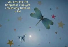 two butterflies flying in the sky with stars around them and a quote written on it