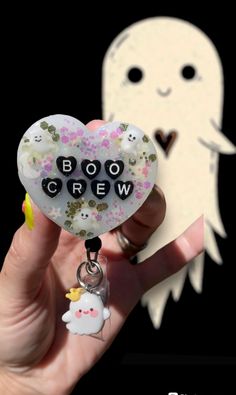 👻 Custom made Boo Crew badge reel! Ghosts and stars glow in the dark :D Finished with a cute little ghostie hanging charm 👻  🖤This reel can also be made with different color beads, resin and/or glitters!  * Please note that each item is handmade and the resin colors are hand mixed- colors may vary slightly as well as bead colors depending on what is available- if there is something you want or don't want specifically (example: no orange beads, etc) on your reel please let me know and I will d Cheap Halloween Novelty Badge Reel, Resin Colors, Dark Ghost, Nursing Teacher, Boo Crew, Color Beads, Resin Charms, Halloween Boo, Mixed Colors