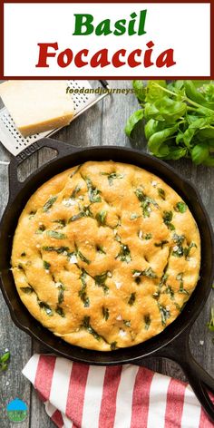 basil focaccia in a cast iron skillet on top of a wooden table