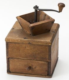 an old wooden box with a hammer sticking out of it's top, on a white background